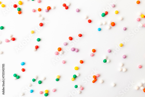 Colorful confectionery sprinkles on white background. Decoration for cake and bakery.