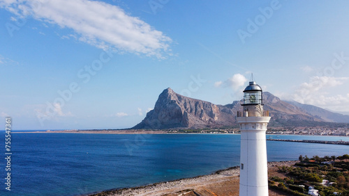 the coast of San Vito Lo Capo with the white lighthouse tower in the foreground