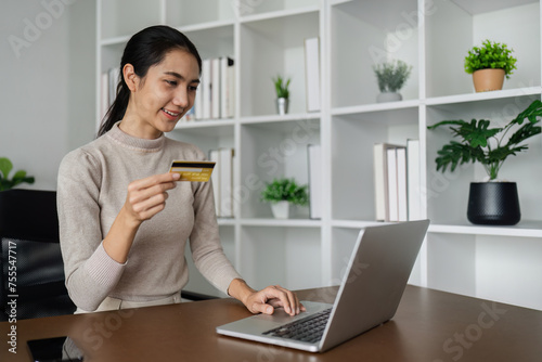 Woman on desk with smartphone, credit card and ecommerce payment for online shopping at home