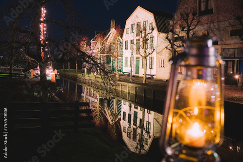 Canals in the Ducth village with characteristic old buildings reflecting in the water. photo