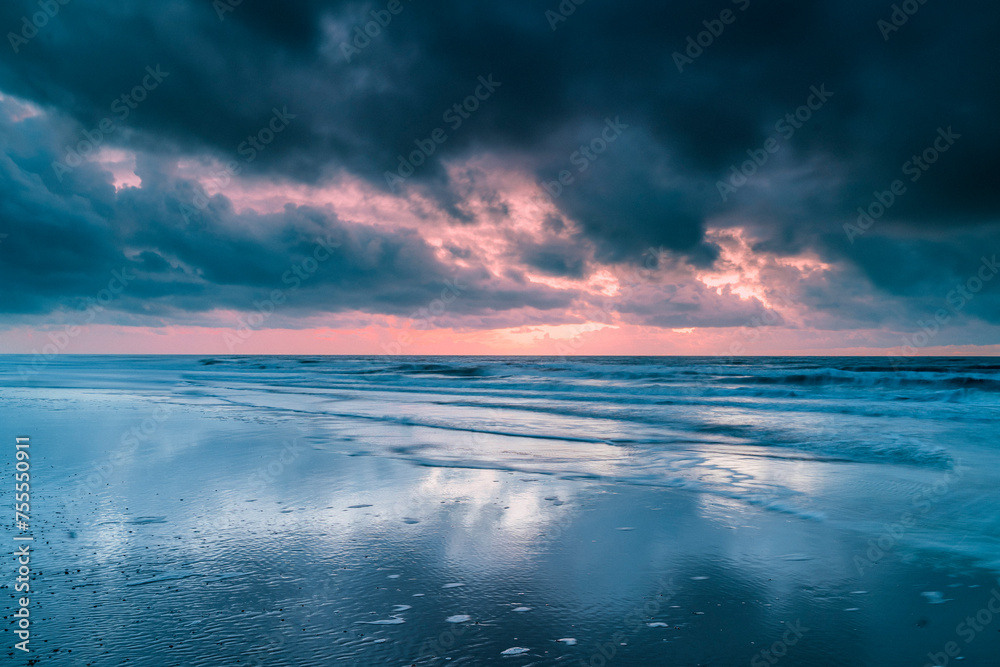 Seascape with dramatic sky and dark clouds above the North Sea
