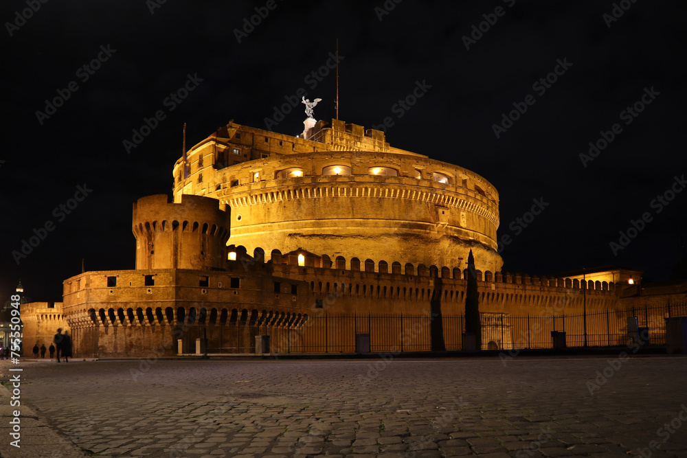Castle of Sant'Angelo and the bridge over the Tiber River at night in Rome, Italy