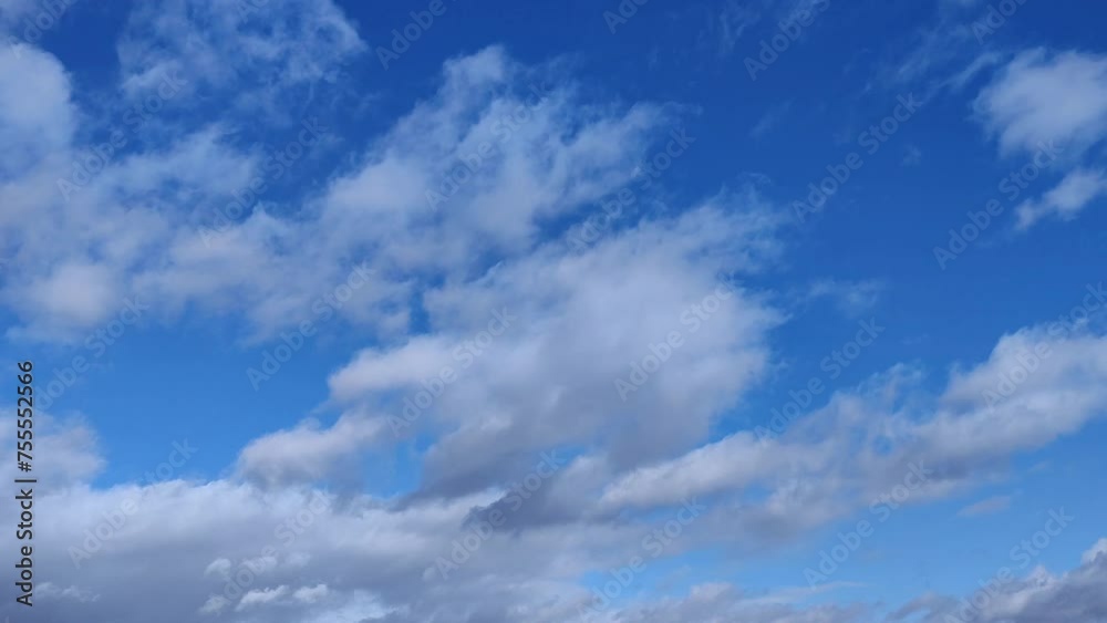 Cumulative clouds circulate across the intense blue sky in the morning Cumulative clouds circulate across the intense blue sky in the morning