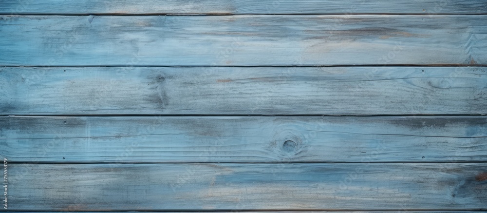 A detailed view of an old wooden wall with peeling blue paint, showcasing a vintage and weathered aesthetic. The texture of the wood and cracking paint adds character to the background, ideal for