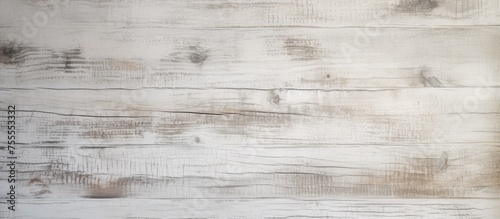 A white wooden wall with a gray stain visible throughout the texture of the wood. The contrast between the white and gray creates a visually interesting pattern and adds character to the wall.