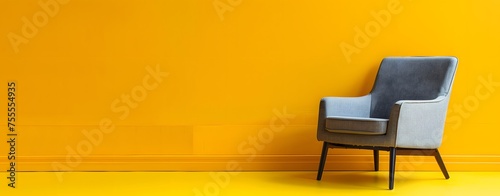 Modern gray chair isolated on orange background, Cozy comfortable chair for indoor space design. interior furniture. Space for text. © Almultazam
