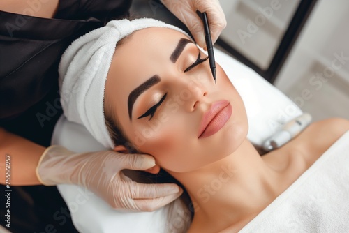 concept of beauty salon and permanent make-up, beautiful Woman at cosmetology cabinet getting permanent makeup