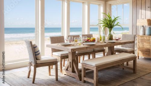 Wooden dining table set on the beach with sea view background. © Hoody Baba