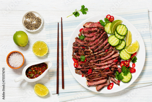 crying tiger, grilled and thinly sliced ribeye steak photo