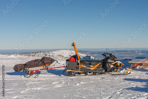 Snowmobile with stretcher mountain rescue service in front of Silesian House in krkonose mountains.
