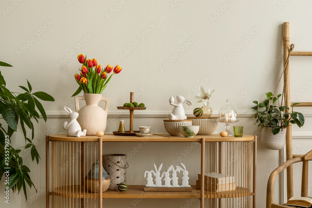 Warm and cozy composition of easter  living room interior with mock up poster frame, vase with tulips, hare sculpture, carrot, bowl, wooden sideboard and personal accessories. Home decor. Template.