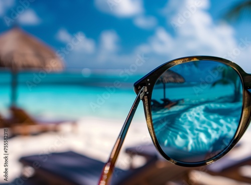 Closeup of a womans sunglasses reflecting a vacation on beach. beautiful woman in glasses outdoors © Svetlana