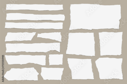 Set of torn white note paper pieces are on light brown background for text or ad.