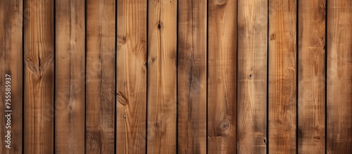A weathered brown wooden wall with vertical pine planks, showcasing a textured surface with visible knots and natural imperfections. The wall exudes a rustic charm with its aged appearance.