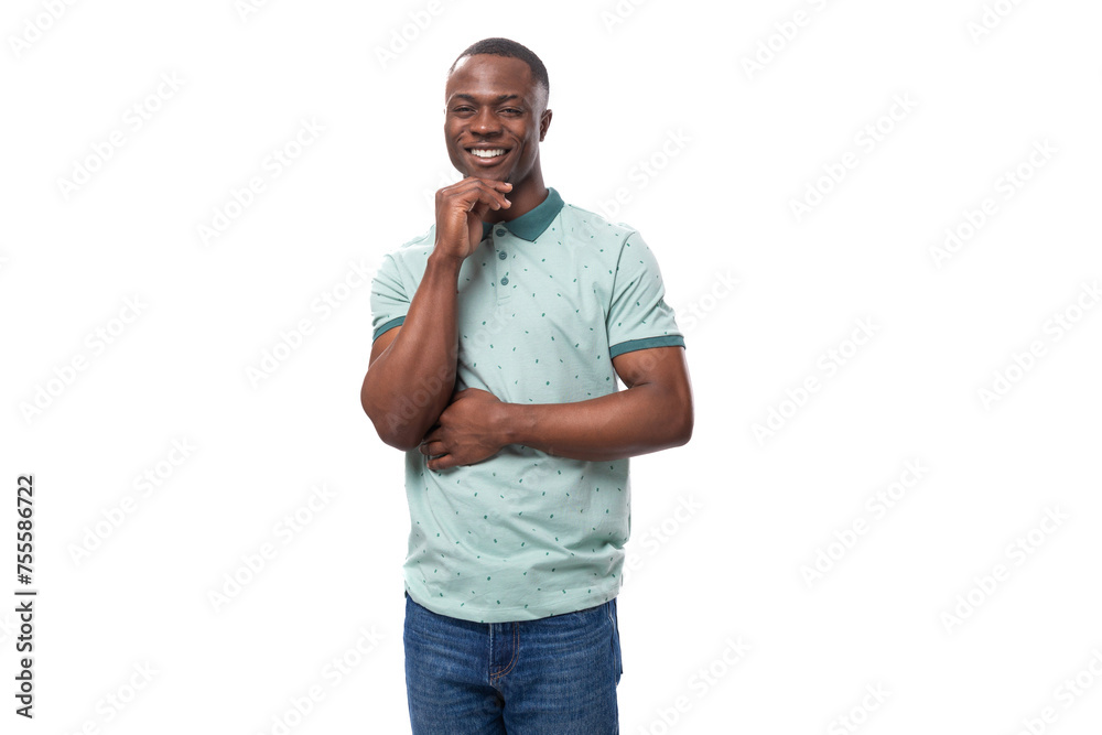 young handsome smiling african man dressed casually on studio background young handsome smiling african man dressed casually on studio background