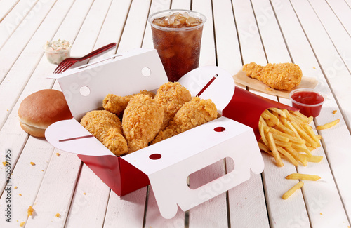 Fotografija variety of chickens buckets and combos, finger licking snacks with delicious sau