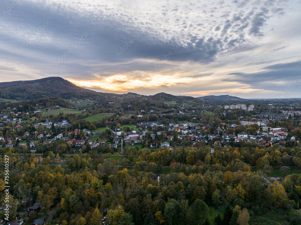 Fototapeta premium Scenery of the town and health resort in Ustron on the hills of the Silesian Beskids, Poland. Aerial drone view of beskid mountains in Ustron. Ustron Aerial View.