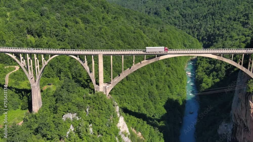 Aerial view on Djurdjevica arch bridge over the Tara River in northern Montenegro, 4k Aerial view on Djurdjevica arch bridge over the Tara River in northern Montenegro, 4k