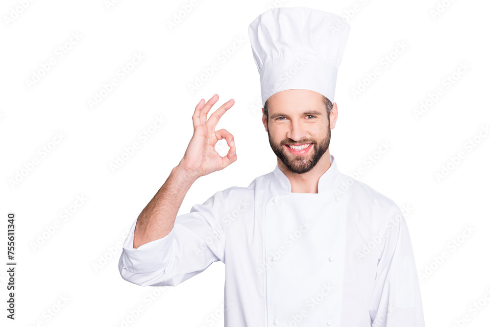Portrait of cheerful joyful chef cook in beret and white outfit with stubble looking at camera showing ok sign, approve, advice menu isolated on grey background Portrait of cheerful joyful chef cook in beret and white outfit with stubble looking at camera showing ok sign, approve, advice menu isolated on grey background
