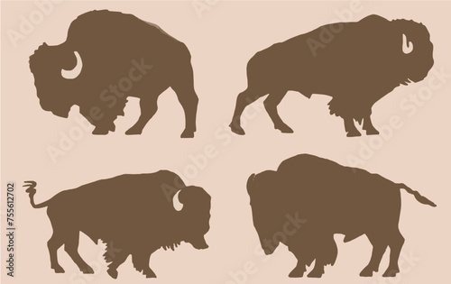 Vector silhouettes of bisons  on sepia background , graphical illustration	