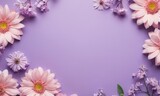 Top view flatlay romantic flowers pink and purple color with space for text in the middle at purple background. Happy Women's Day and Mother's Day concept.