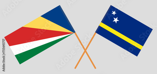 Crossed flags of Seychelles and Country of Curacao. Official colors. Correct proportion