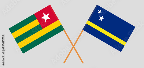 Crossed flags of Togo and Country of Curacao. Official colors. Correct proportion