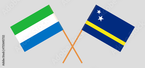 Crossed flags of Sierra Leone and Country of Curacao. Official colors. Correct proportion