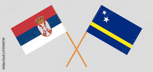 Crossed flags of Serbia and Country of Curacao. Official colors. Correct proportion