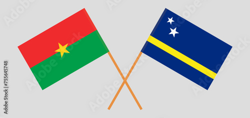 Crossed flags of Burkina Faso and Country of Curacao. Official colors. Correct proportion
