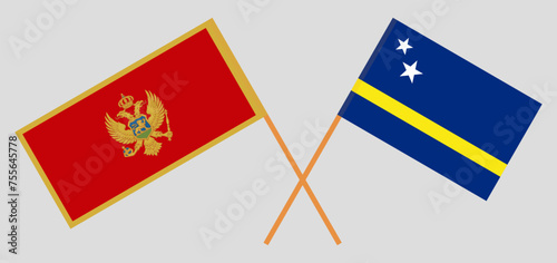 Crossed flags of Montenegro and Country of Curacao. Official colors. Correct proportion