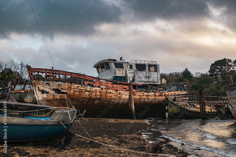 Old boats at the ship cemetery at the coastline of Brittany