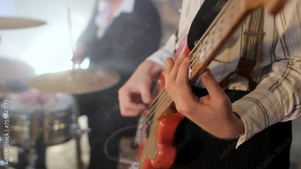 rhythm section with bass player and drummer rehearsing rhythm section with bass player and drummer rehearsing