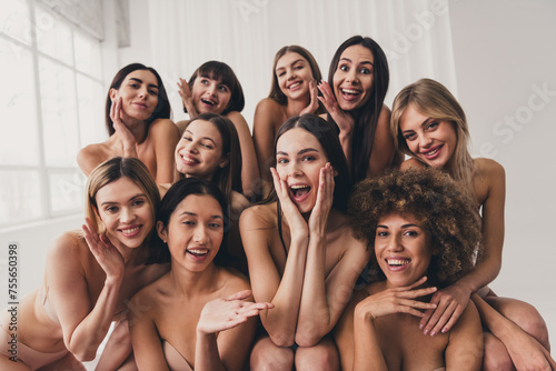 Photo of group beautiful women in brassieres touch skin after spa procedures isolated at studio white color background © deagreez