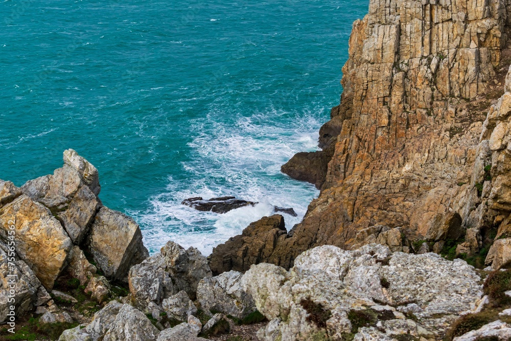 Grey cliffs of Brittany and winter ocean