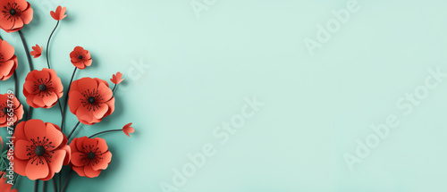 A vibrant red poppy paper flowers against a soothing teal background, a banner with copy space, a calm and peaceful ambiance, making it perfect for themes related to spring, nature, or tranquility photo