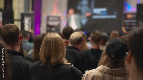 Wallpaper Mural Audience of young professionals observes tech innovation presentation, engaging with new industry trends. Innovators share cutting-edge technologies at a conference, presenting to youthful audience. Torontodigital.ca