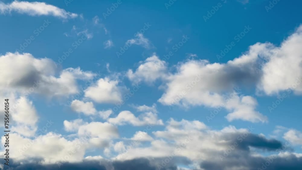 Expansive blue sky adorned with soft, fluffy clouds, capturing the essence of tranquillity in the English Countryside Expansive blue sky adorned with soft, fluffy clouds, capturing the essence of tranquillity in the English Countryside