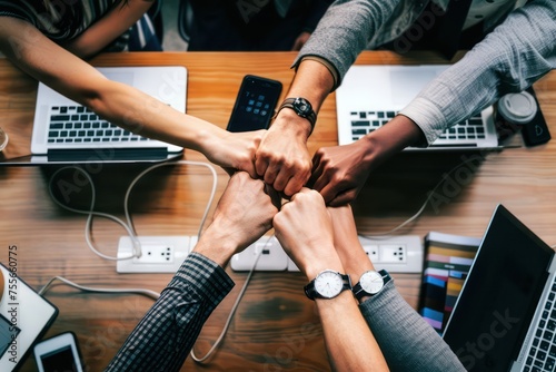 teamwork on a table with lots of hands