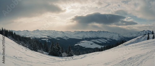Snow Covered Ski Slope With Mountains in Background