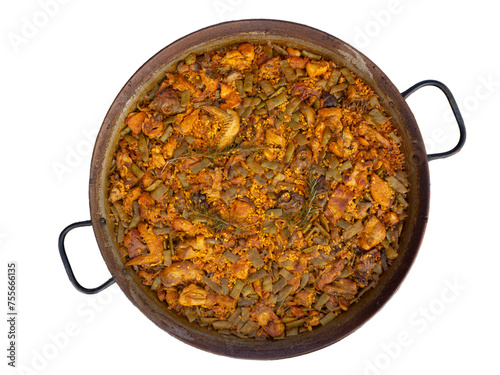 Typical Valencian paella, made with rice, chicken, rabbit and green beans, on a white background. Paella Valenciana
