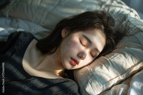 Woman lying in bed sleeping on a pillow, concept of relaxation, rest.