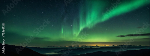 Northern Lights Display Over Mountainous Landscape at Night