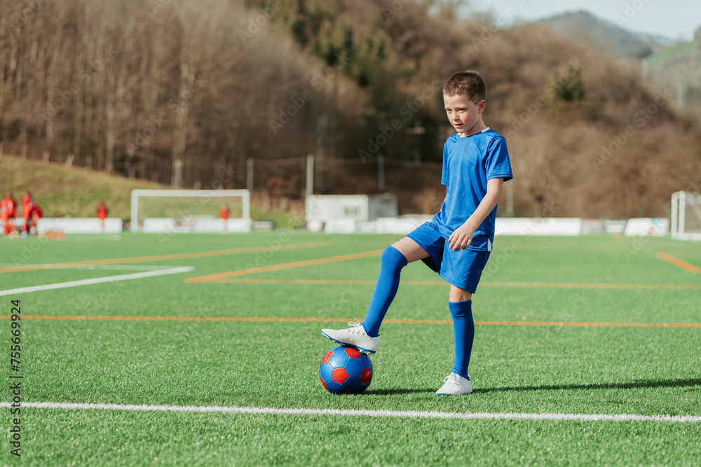 Young soccer player practicing on field Young soccer player practicing on field