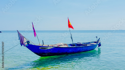 Vietnamese boat on blue sea © Arnaud