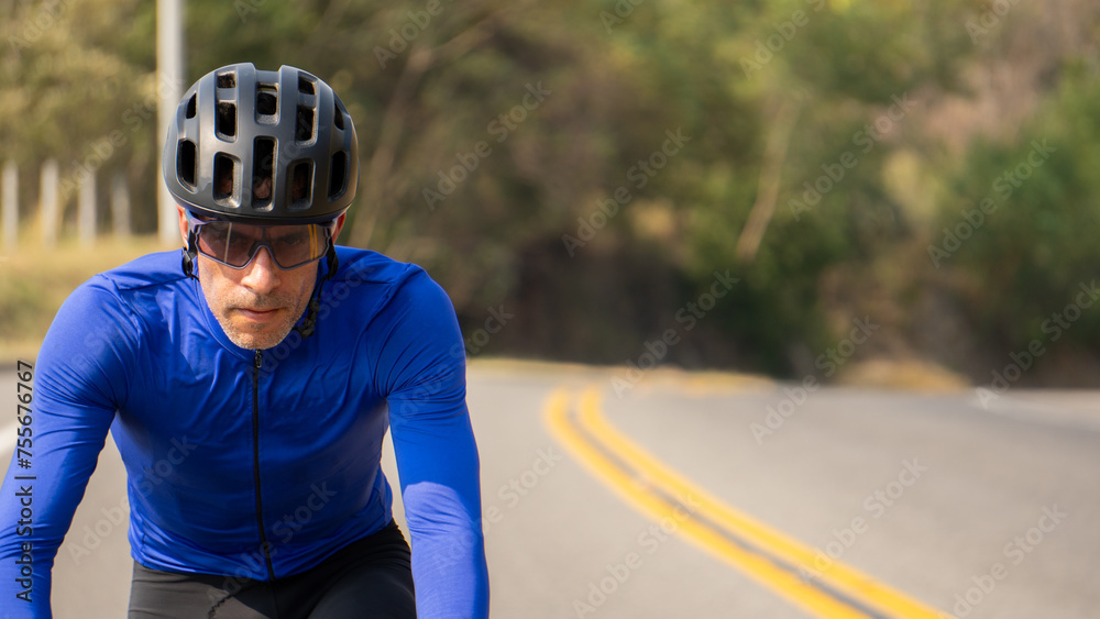 Man riding bicycle on a road outdoors