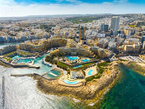 Landscape of f St. Julian's city, high buildings. Day. Maltese island, Mediterranean sea
