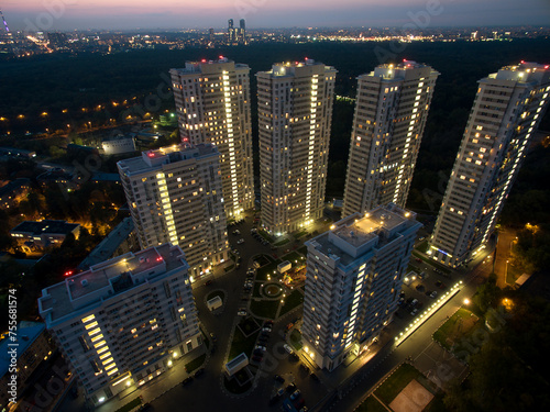 Residential complex against cityscape at evening in Moscow. Aerial view videoframe photo