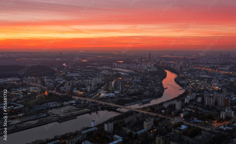 Modern highway, bridge, river and industrial area in Moscow, Russia at evening
