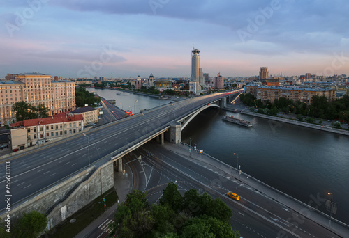 Big Bridge Krasnokholmsky, ship on river, evening quay in Moscow, Russia photo